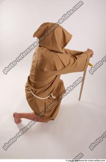 14 2018 01 JOEL ADAMSON MONK KNEELING POSE WITH SWORD